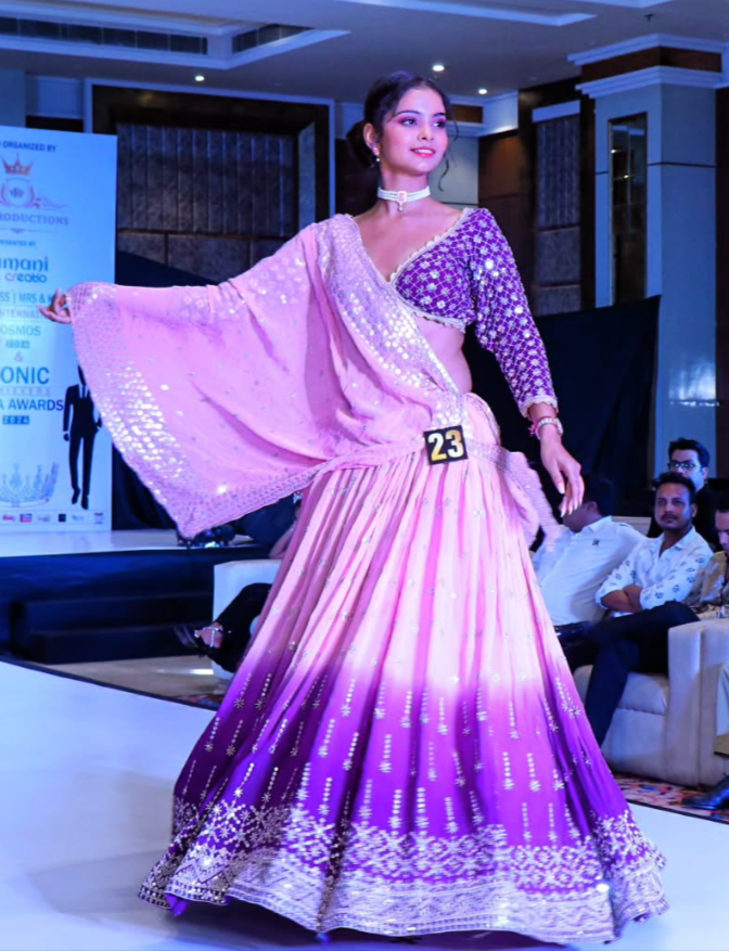 Shuchi twirling lavender and teal dupatta on runway